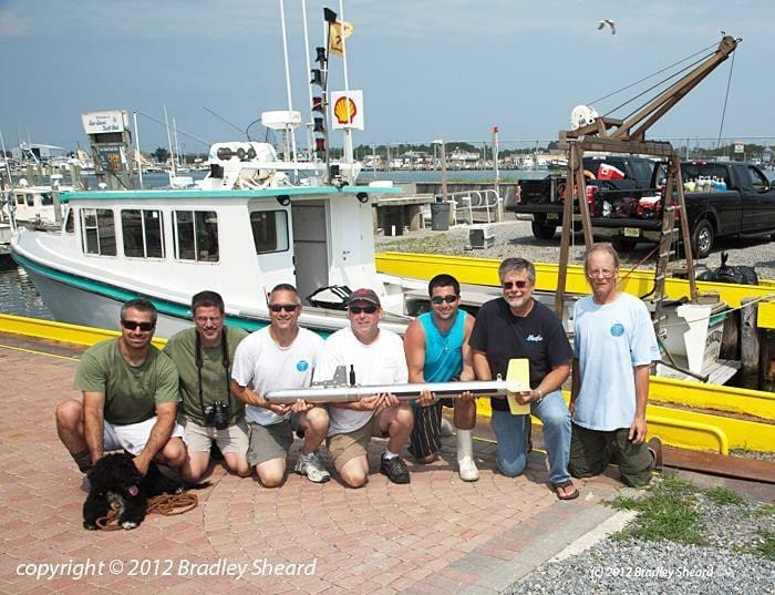 A group of men standing next to each other.