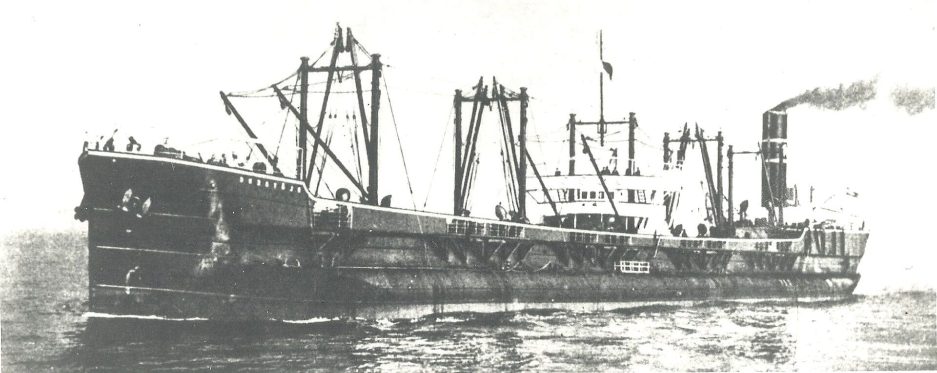 A large boat with two masts on it's side.