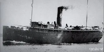 A large boat with smoke coming out of the top.