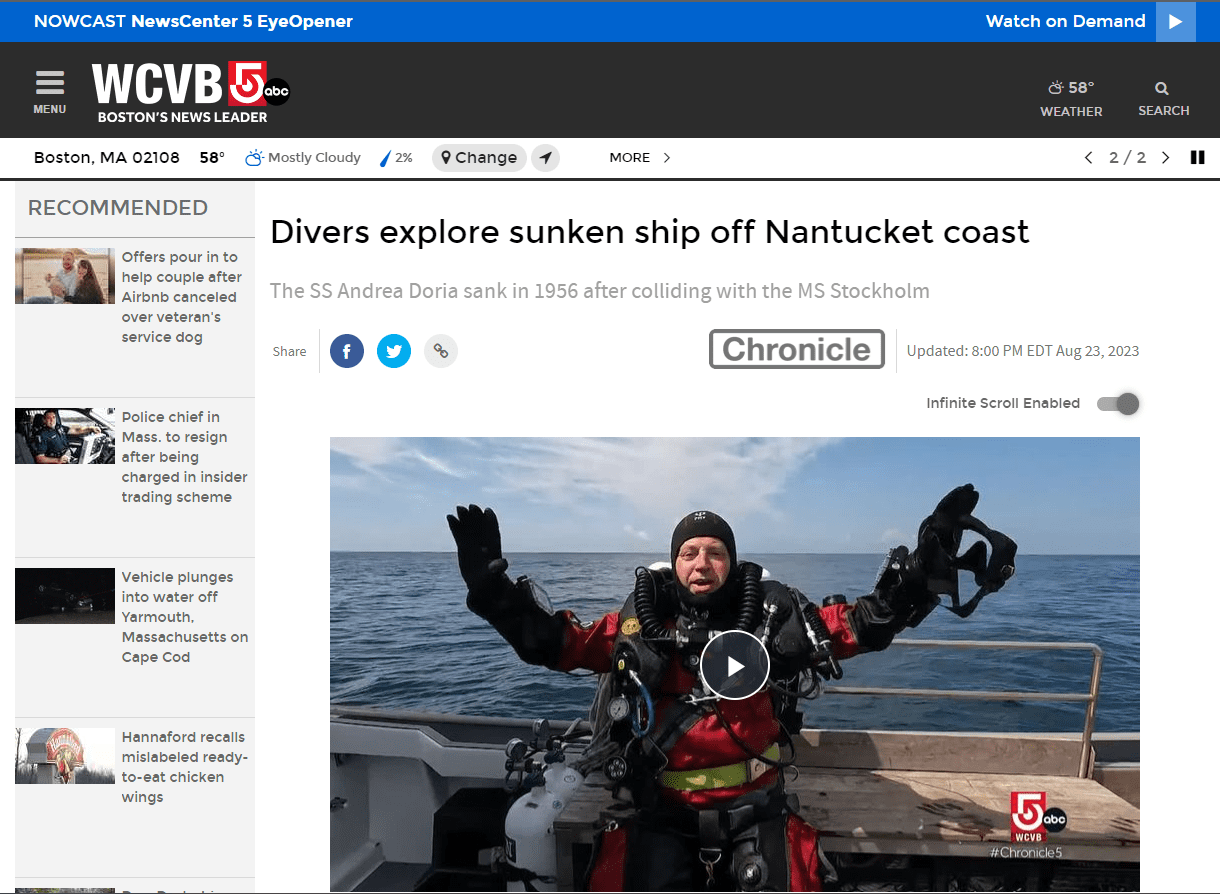 A man in a scuba suit on a boat.