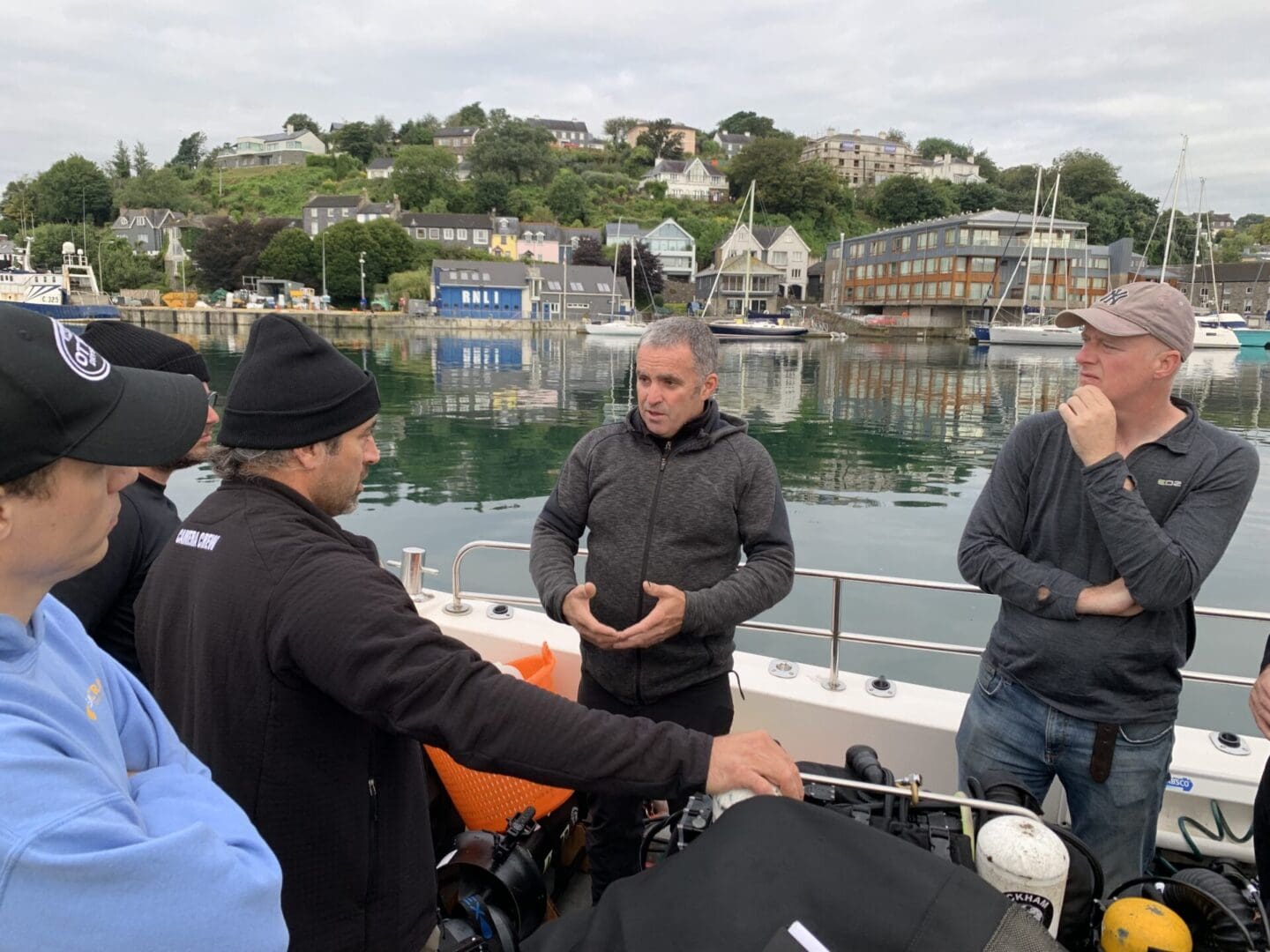 Divers plan with Eoin McGarry (center) before their first dive on <i>Lusitania.</i> Photo © Jennifer Sellitti 2021.
