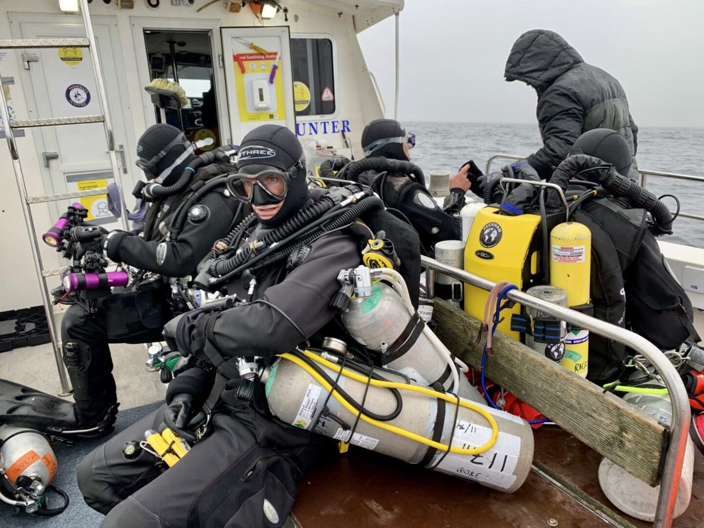 Divers suiting up in their rebreathers just before splashing on <i>Lusitania.</i> Photo © Jennifer Sellitti 2021.
