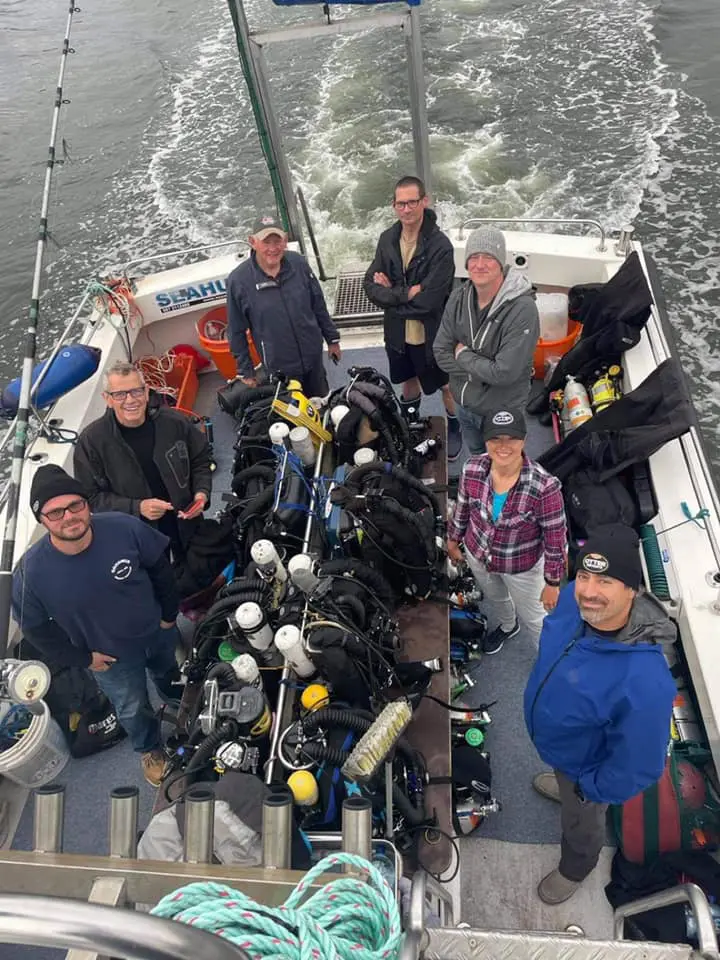 Members of the August 2021 expedition heading out to the <i>Lusitania dive site.</i> Photo © D/V Tenacious 2021.
