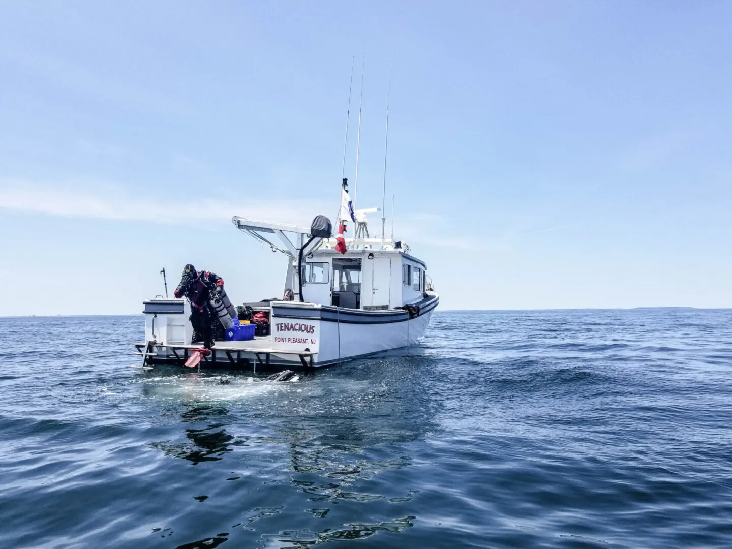 A diver splashing from D/V Tenacious during operations offshore. Photo © Jennifer Sellitti 2021.